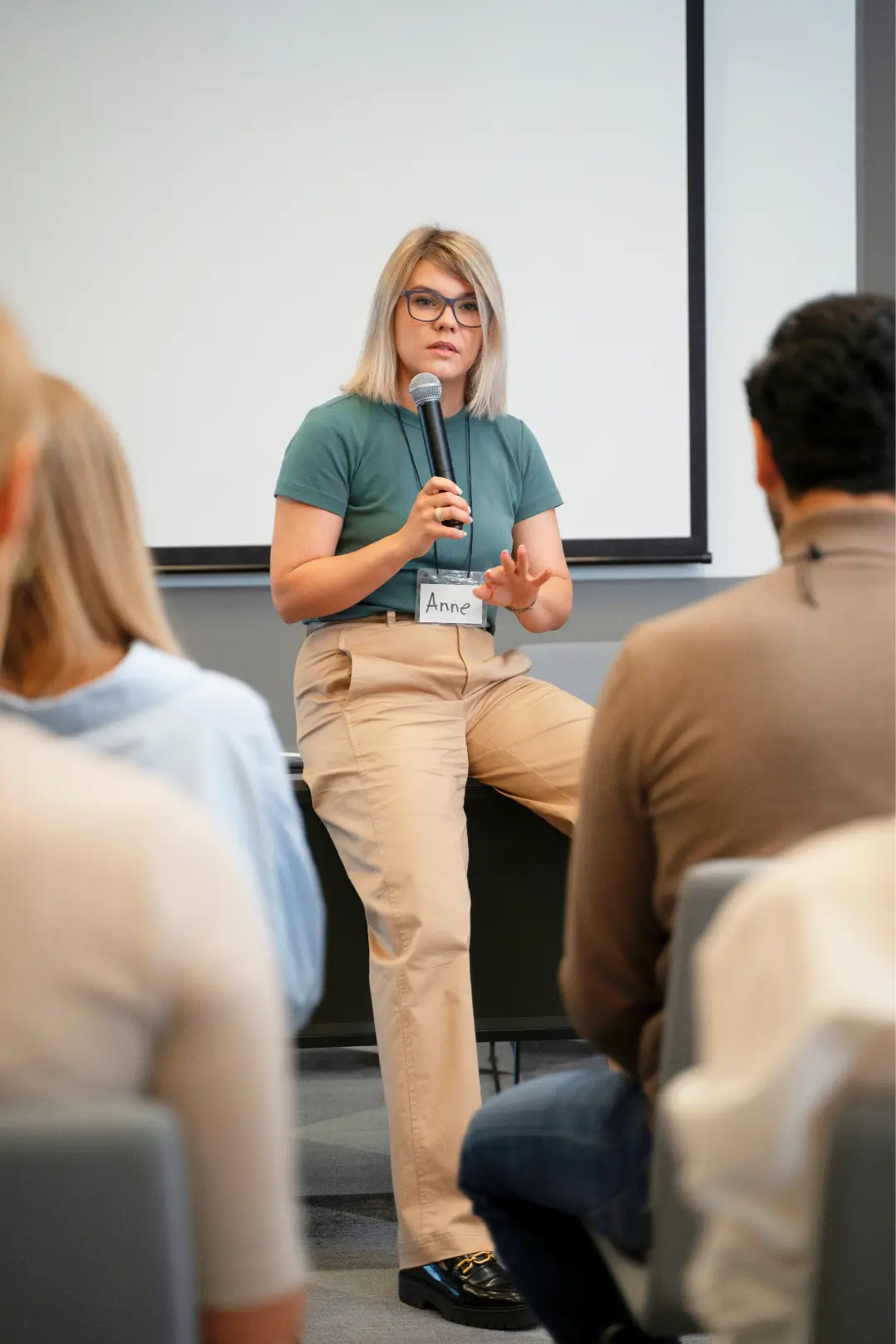 An Abuse Counseling & Therapy speaker addresses a group during a trauma-informed workshop.