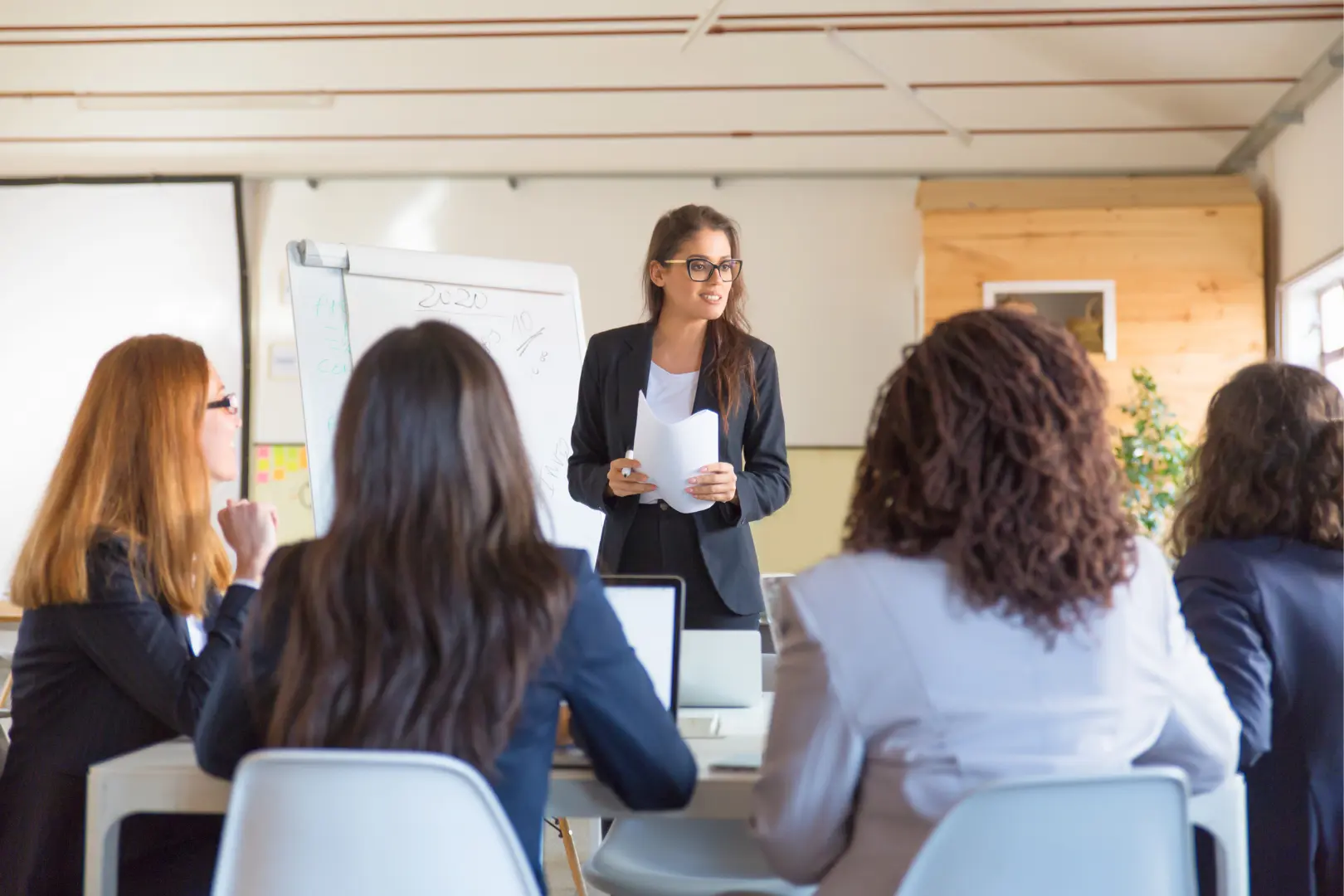 An Abuse Counseling & Therapy facilitator leads a supportive group workshop for women.
