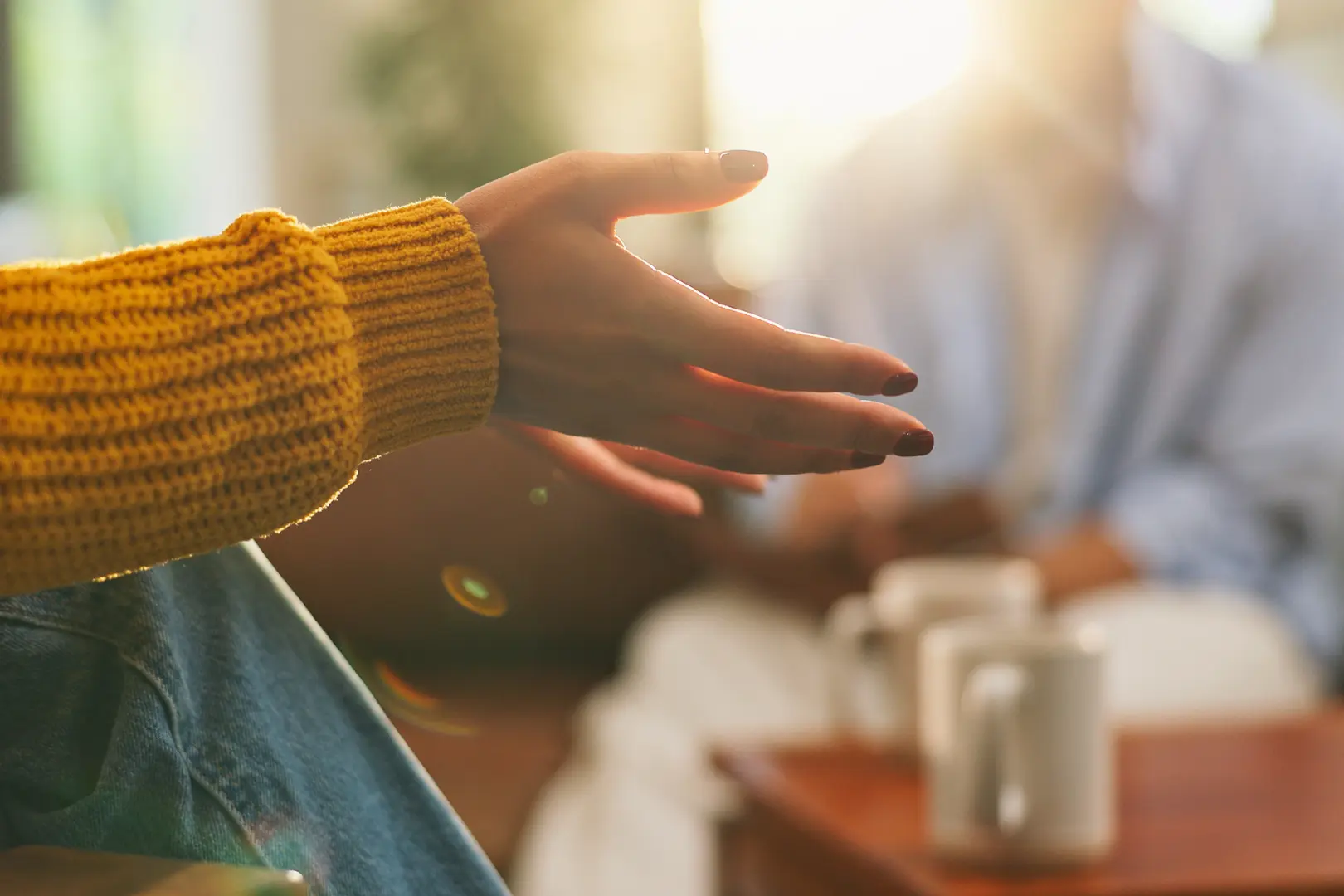 A client gestures during a supportive session at Abuse Counseling & Therapy.