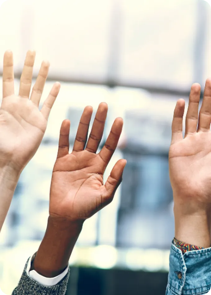 Three diverse hands raised in support, representing inclusive care at Abuse Counseling & Therapy.