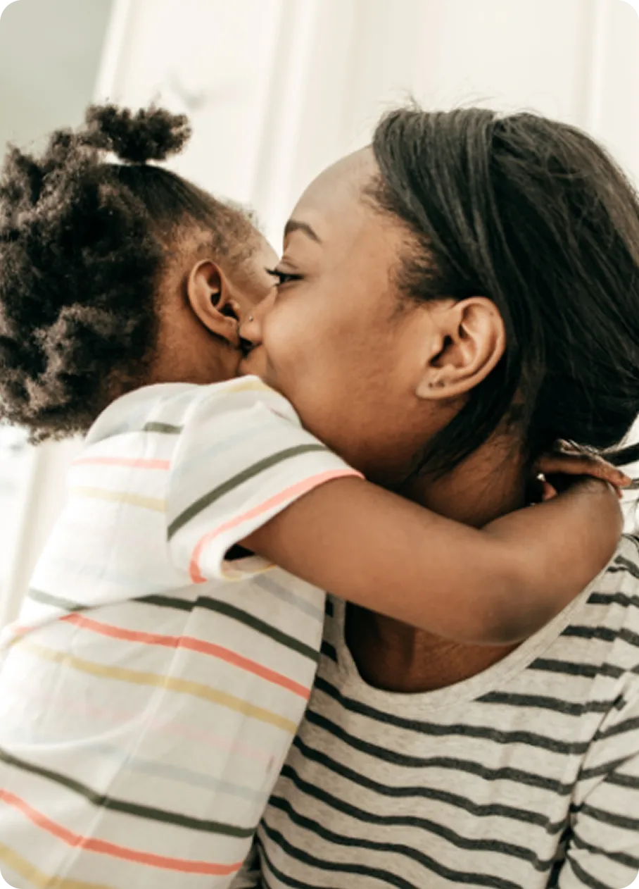 A mother and child share a warm embrace, reflecting the healing care at Abuse Counseling & Therapy.