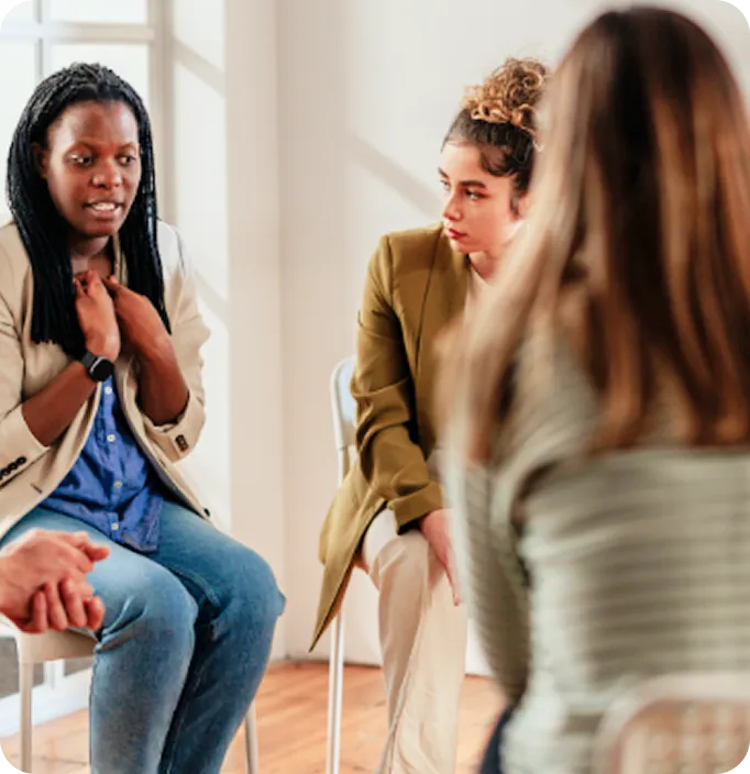 Women sharing and listening during a supportive group therapy session at Abuse Counseling & Therapy.