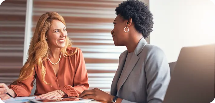 A counselor at Abuse Counseling & Therapy smiles warmly during a supportive session with a client.