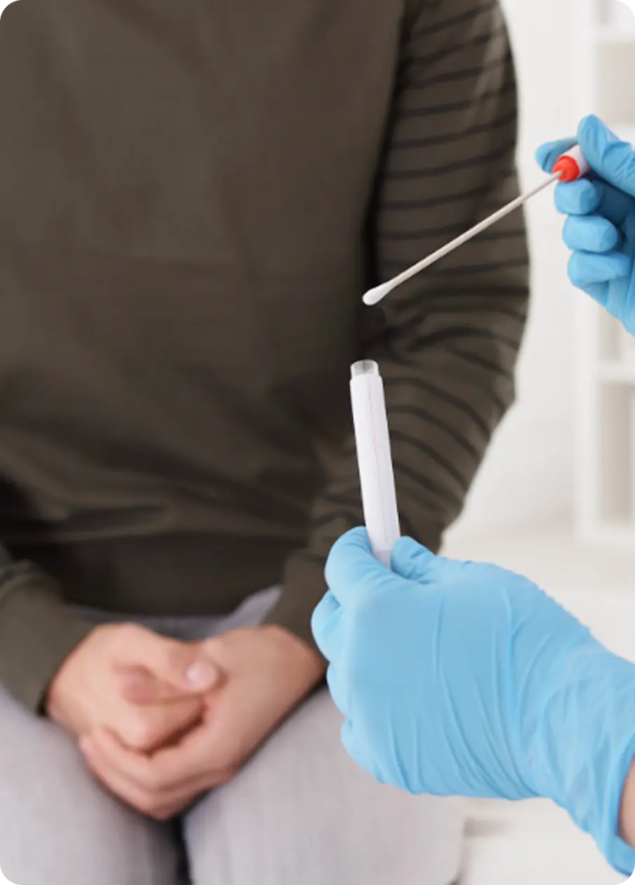 A clinician at Abuse Counseling & Therapy prepares a medical swab for a patient's exam.