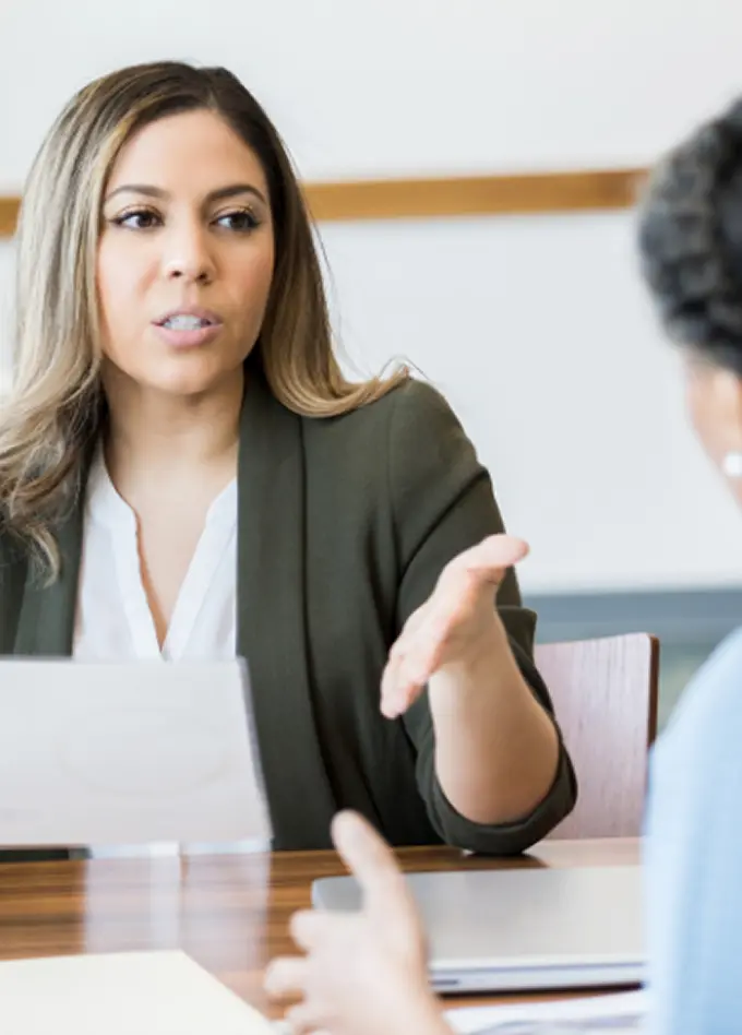 A counselor at Abuse Counseling & Therapy speaks supportively with a client during a session.